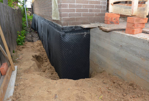 Happy homeowners after waterproofing job in McDonald
